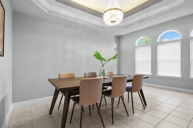 6516 NW 109th Pl, Alachua, FL 32615 - dining room with a tray ceiling, a chandelier, ornamental molding, light tile patterned floors, and baseboards