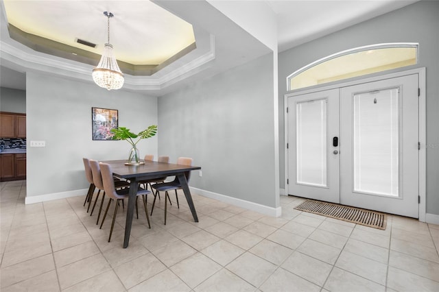 6516 NW 109th Pl, Alachua, FL 32615 - dining area with a chandelier, light tile patterned floors, french doors, and baseboards