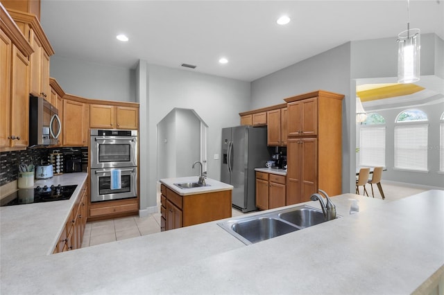 6516 NW 109th Pl, Alachua, FL 32615 - kitchen featuring appliances with stainless steel finishes, a sink, a kitchen island with sink, light tile patterned floors, and recessed lighting