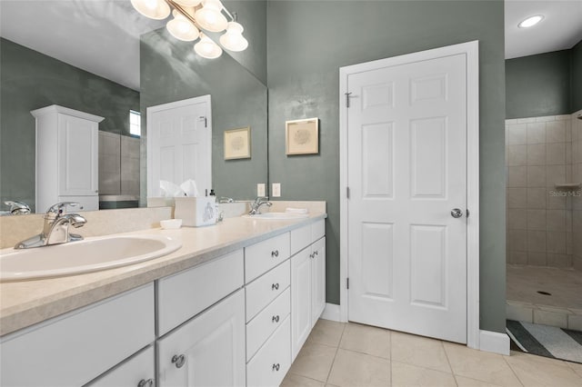 6516 NW 109th Pl, Alachua, FL 32615 - bathroom featuring double vanity, tiled shower, tile patterned flooring, a chandelier, and baseboards