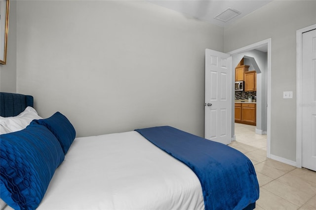 6516 NW 109th Pl, Alachua, FL 32615 - bedroom with light tile patterned flooring and baseboards