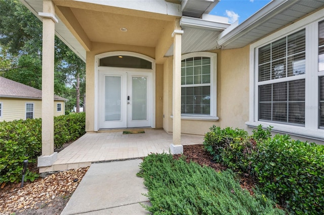 6516 NW 109th Pl, Alachua, FL 32615 - entrance to property with stucco siding and french doors