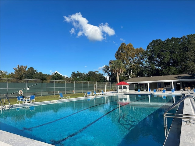 6516 NW 109th Pl, Alachua, FL 32615 - community pool with a patio area