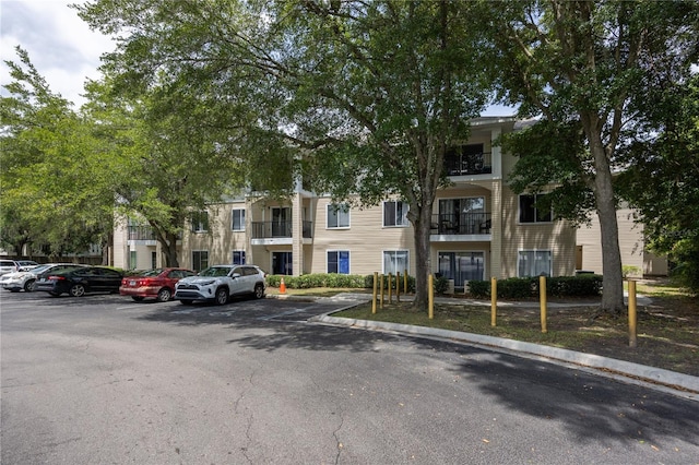 3921 SW 34th St Unit 106, Gainesville, FL 32608 - view of property featuring uncovered parking