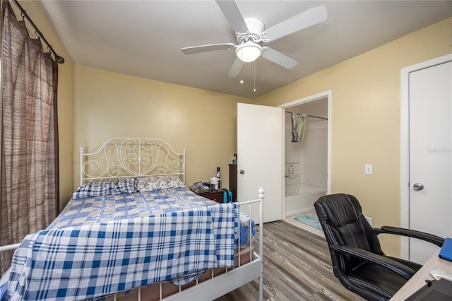 3921 SW 34th St Unit 106, Gainesville, FL 32608 - bedroom featuring wood finished floors, a desk, and ceiling fan