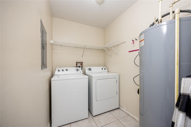 3921 SW 34th St Unit 106, Gainesville, FL 32608 - laundry area with water heater, washing machine and clothes dryer, light tile patterned floors, and electric panel