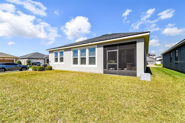 13201 Orca Sound Dr, Riverview, FL 33579 - rear view of house with stucco siding, a sunroom, and a lawn