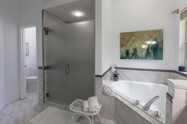 2072 SW 66th Dr, Gainesville, FL 32607 - full bath featuring a garden tub, a shower stall, a textured ceiling, and marble finish floors