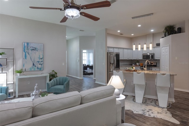 2072 SW 66th Dr, Gainesville, FL 32607 - living room with dark wood finished floors, a ceiling fan, and recessed lighting