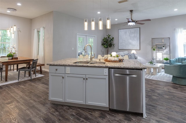 2072 SW 66th Dr, Gainesville, FL 32607 - kitchen featuring stainless steel dishwasher, open floor plan, a ceiling fan, dark wood-type flooring, and decorative light fixtures