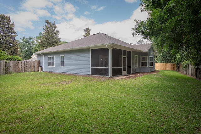 2072 SW 66th Dr, Gainesville, FL 32607 - rear view of house featuring a fenced backyard, a sunroom, and a shingled roof