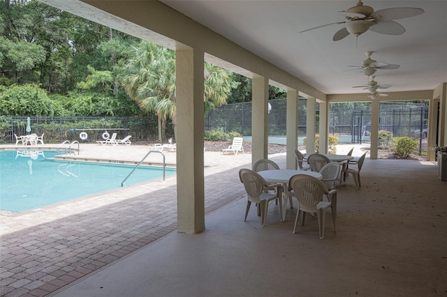 2072 SW 66th Dr, Gainesville, FL 32607 - community pool with a patio, a ceiling fan, and outdoor dining area