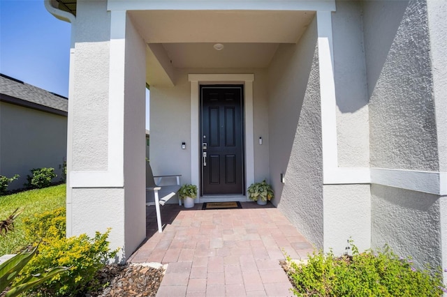 1192 Via Galuppi St, Poinciana, FL 34759 - doorway to property with stucco siding