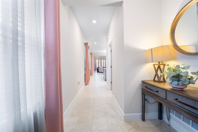 1192 Via Galuppi St, Poinciana, FL 34759 - hall with recessed lighting, baseboards, and light marble finish floors