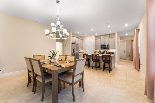 1192 Via Galuppi St, Poinciana, FL 34759 - dining area featuring a chandelier, baseboards, and recessed lighting