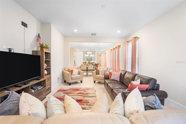1192 Via Galuppi St, Poinciana, FL 34759 - living area with a chandelier, baseboards, and recessed lighting