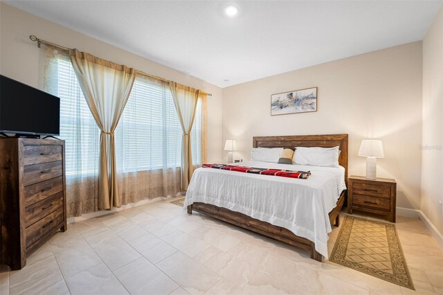 1192 Via Galuppi St, Poinciana, FL 34759 - bedroom with baseboards and tile patterned floors