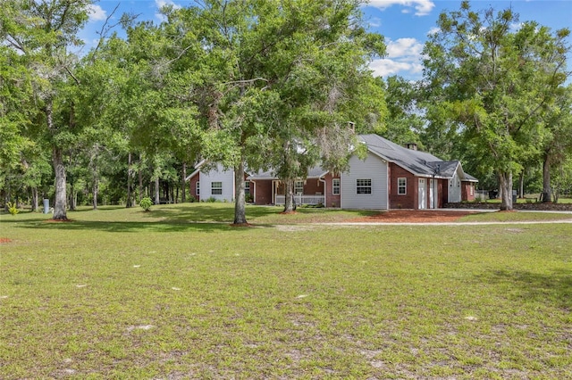 1827 SW Shiloh St, Fort White, FL 32038 - view of green lawn featuring a garage