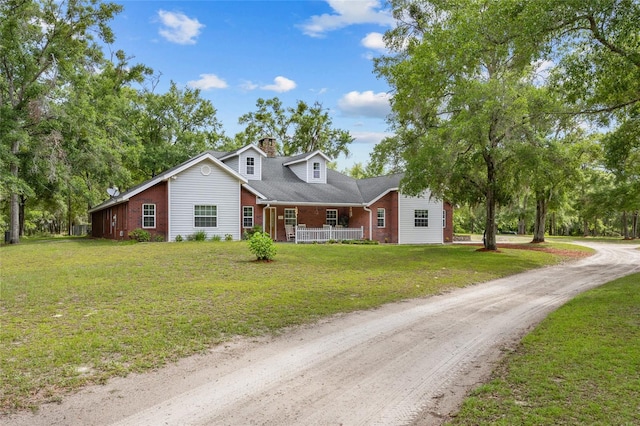 1827 SW Shiloh St, Fort White, FL 32038 - view of front facade featuring brick siding, a front lawn, and a chimney