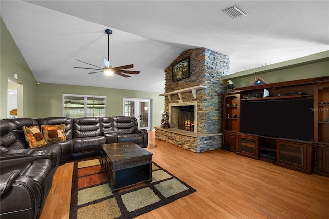 1827 SW Shiloh St, Fort White, FL 32038 - living area featuring a ceiling fan, lofted ceiling, wood finished floors, and a fireplace