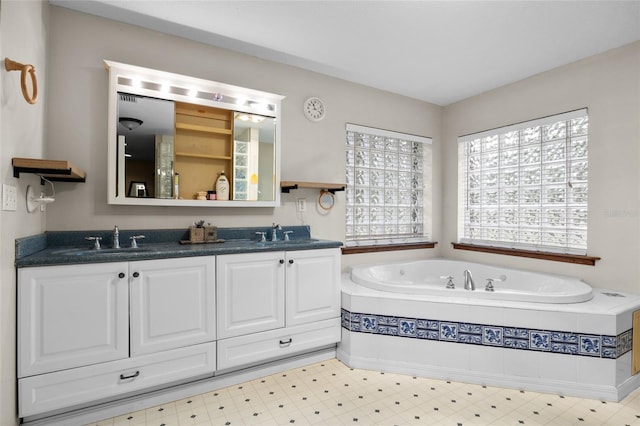1827 SW Shiloh St, Fort White, FL 32038 - full bathroom featuring double vanity, a garden tub, and tile patterned floors