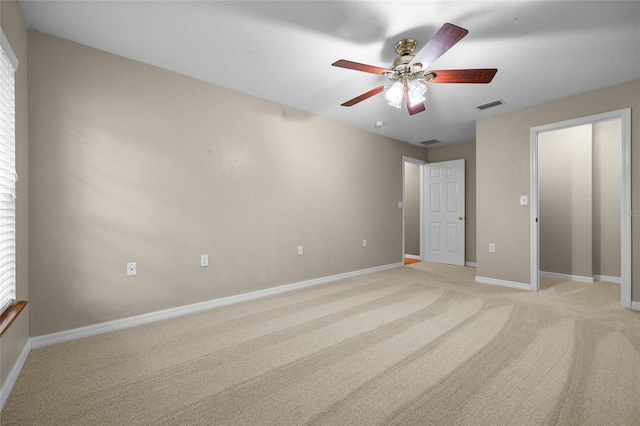 1827 SW Shiloh St, Fort White, FL 32038 - unfurnished bedroom featuring light colored carpet, baseboards, and a ceiling fan