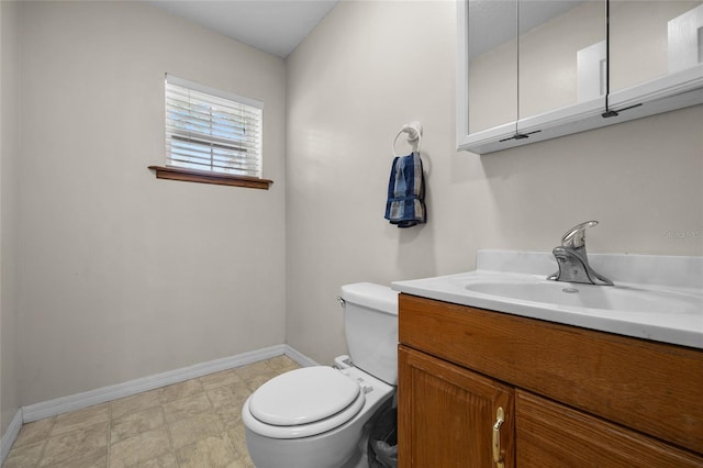 1827 SW Shiloh St, Fort White, FL 32038 - bathroom featuring baseboards, toilet, and vanity