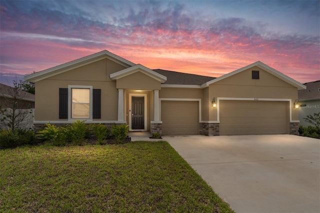 8123 SW 57th Ct, Ocala, FL 34476 - view of front facade with stone siding, an attached garage, driveway, stucco siding, and a front yard