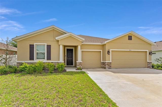 8123 SW 57th Ct, Ocala, FL 34476 - view of front of house featuring stone siding, stucco siding, a garage, a front lawn, and concrete driveway