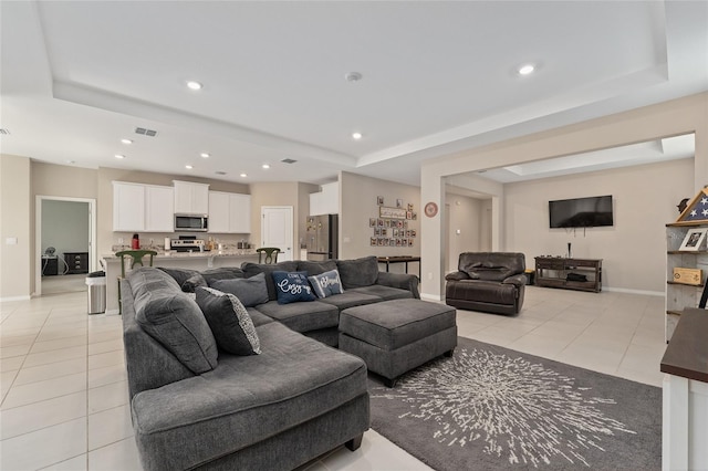 8123 SW 57th Ct, Ocala, FL 34476 - living area featuring a raised ceiling, light tile patterned floors, and recessed lighting