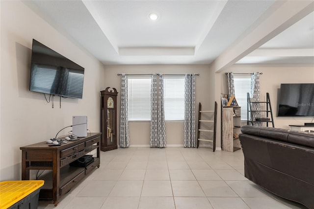 8123 SW 57th Ct, Ocala, FL 34476 - living area featuring a tray ceiling and baseboards