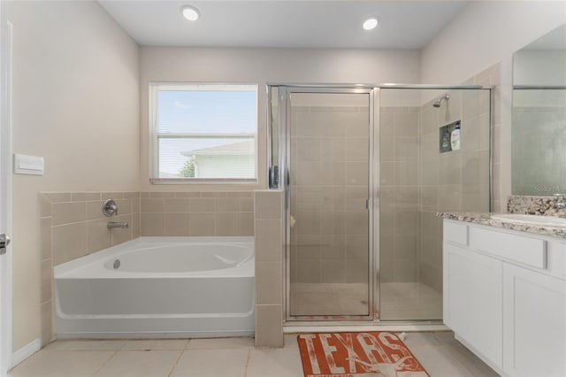 8123 SW 57th Ct, Ocala, FL 34476 - full bath featuring tile patterned floors, a garden tub, vanity, and a stall shower
