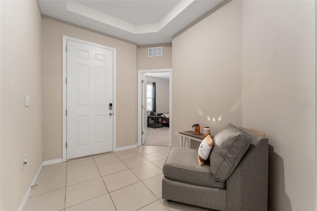 8123 SW 57th Ct, Ocala, FL 34476 - foyer entrance with light tile patterned flooring, baseboards, and a tray ceiling