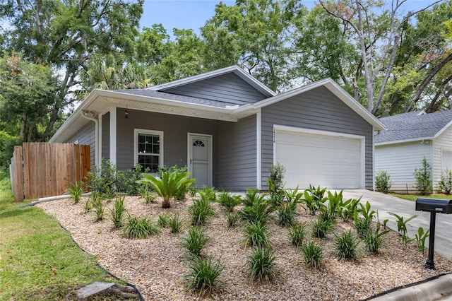 14214 NW 154th Pl, Alachua, FL 32615 - view of front of house featuring a garage, driveway, and a shingled roof