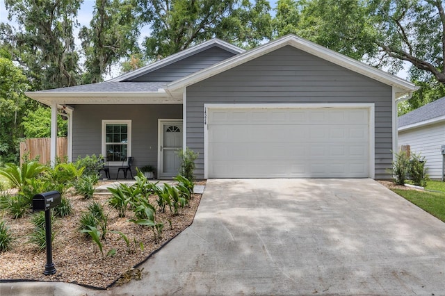 14214 NW 154th Pl, Alachua, FL 32615 - view of front of house with driveway and an attached garage