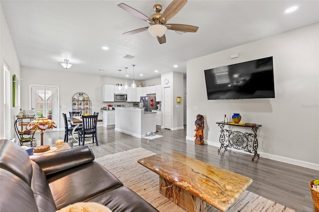 14214 NW 154th Pl, Alachua, FL 32615 - living room with a ceiling fan, wood finished floors, baseboards, and recessed lighting