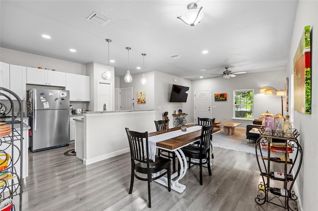 14214 NW 154th Pl, Alachua, FL 32615 - dining room with light wood finished floors, a ceiling fan, recessed lighting, and baseboards