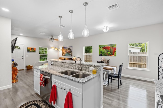 14214 NW 154th Pl, Alachua, FL 32615 - kitchen featuring a sink, dishwasher, light wood-type flooring, white cabinetry, and recessed lighting