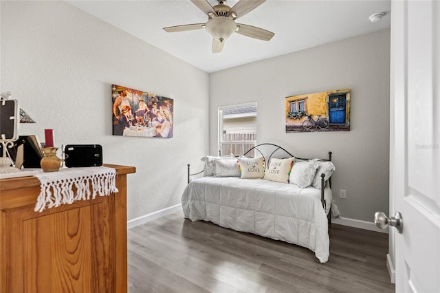 14214 NW 154th Pl, Alachua, FL 32615 - bedroom with wood finished floors, baseboards, and ceiling fan