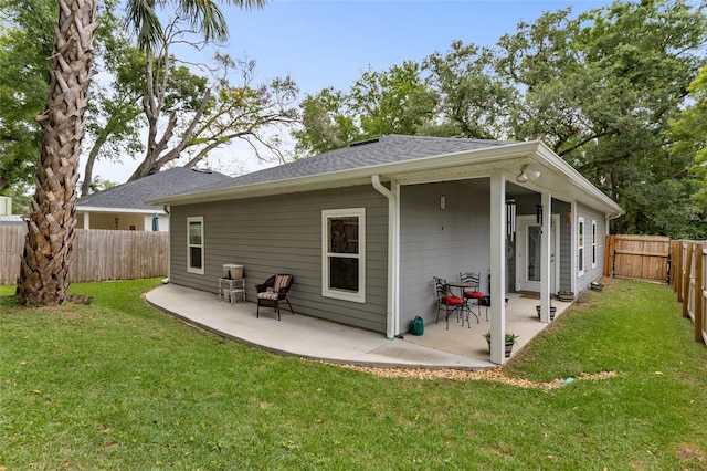 14214 NW 154th Pl, Alachua, FL 32615 - back of property with a patio and a shingled roof
