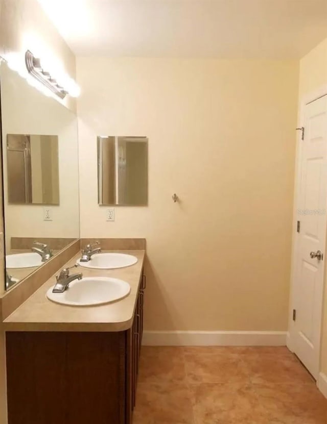 2915 SW 35th Pl Unit 102, Gainesville, FL 32608 - full bath featuring double vanity and baseboards