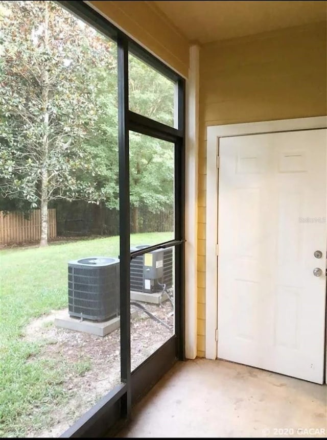 2915 SW 35th Pl Unit 102, Gainesville, FL 32608 - doorway featuring unfinished concrete flooring