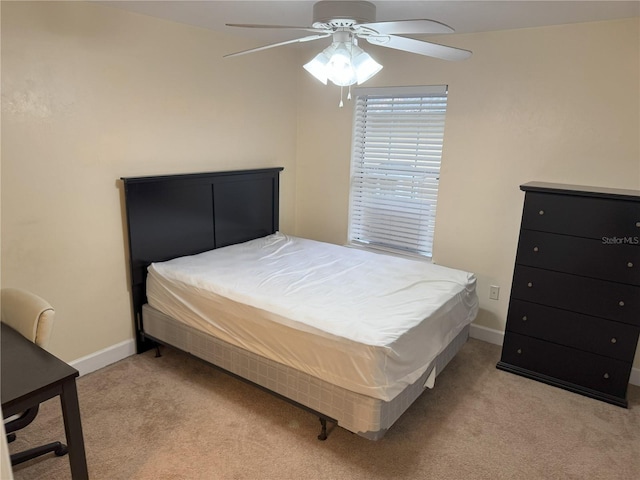 2915 SW 35th Pl Unit 102, Gainesville, FL 32608 - bedroom with light colored carpet and a ceiling fan