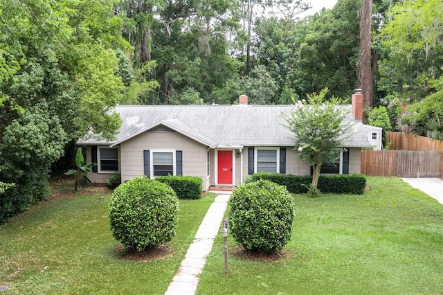 1404 NW 10th Ave, Gainesville, FL 32605 - ranch-style home with a chimney and roof with shingles
