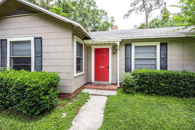 1404 NW 10th Ave, Gainesville, FL 32605 - doorway to property with a chimney