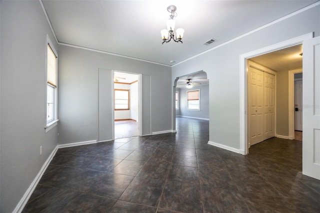 1404 NW 10th Ave, Gainesville, FL 32605 - tiled spare room featuring a chandelier, a ceiling fan, and ornamental molding
