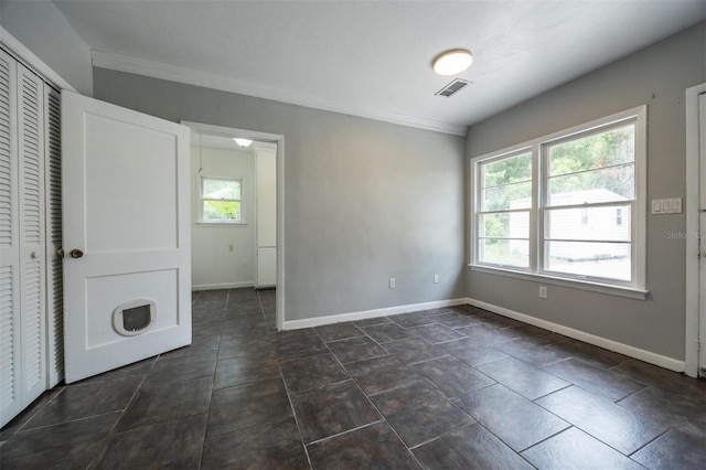 1404 NW 10th Ave, Gainesville, FL 32605 - unfurnished bedroom with ornamental molding