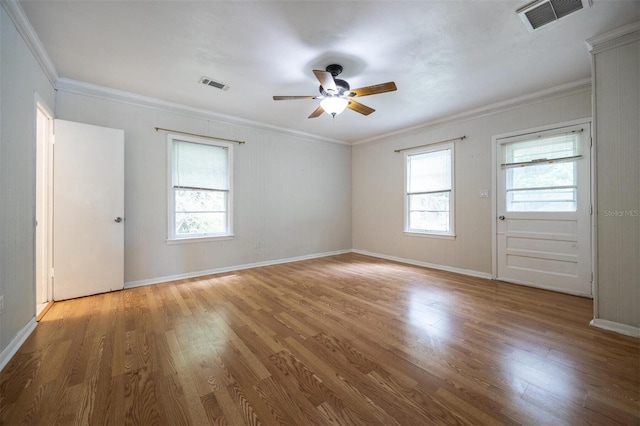 1404 NW 10th Ave, Gainesville, FL 32605 - empty room featuring a ceiling fan, wood finished floors, and crown molding