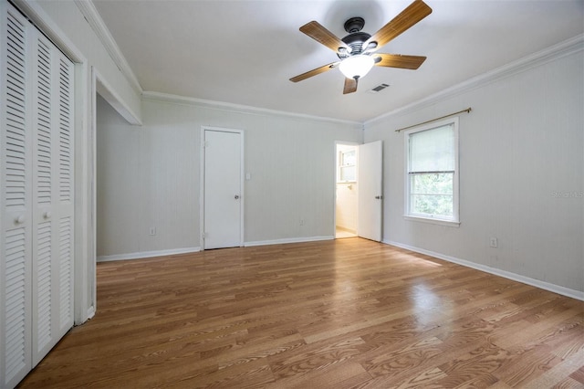 1404 NW 10th Ave, Gainesville, FL 32605 - unfurnished bedroom with crown molding, wood finished floors, and a ceiling fan