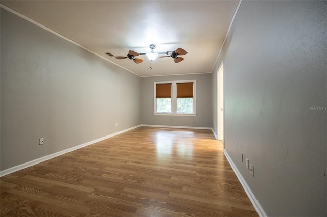 1404 NW 10th Ave, Gainesville, FL 32605 - unfurnished room featuring crown molding, wood finished floors, and ceiling fan
